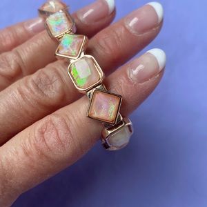 Stretchy Bracelet in Rose Gold color with opalescent-look faux gemstones
